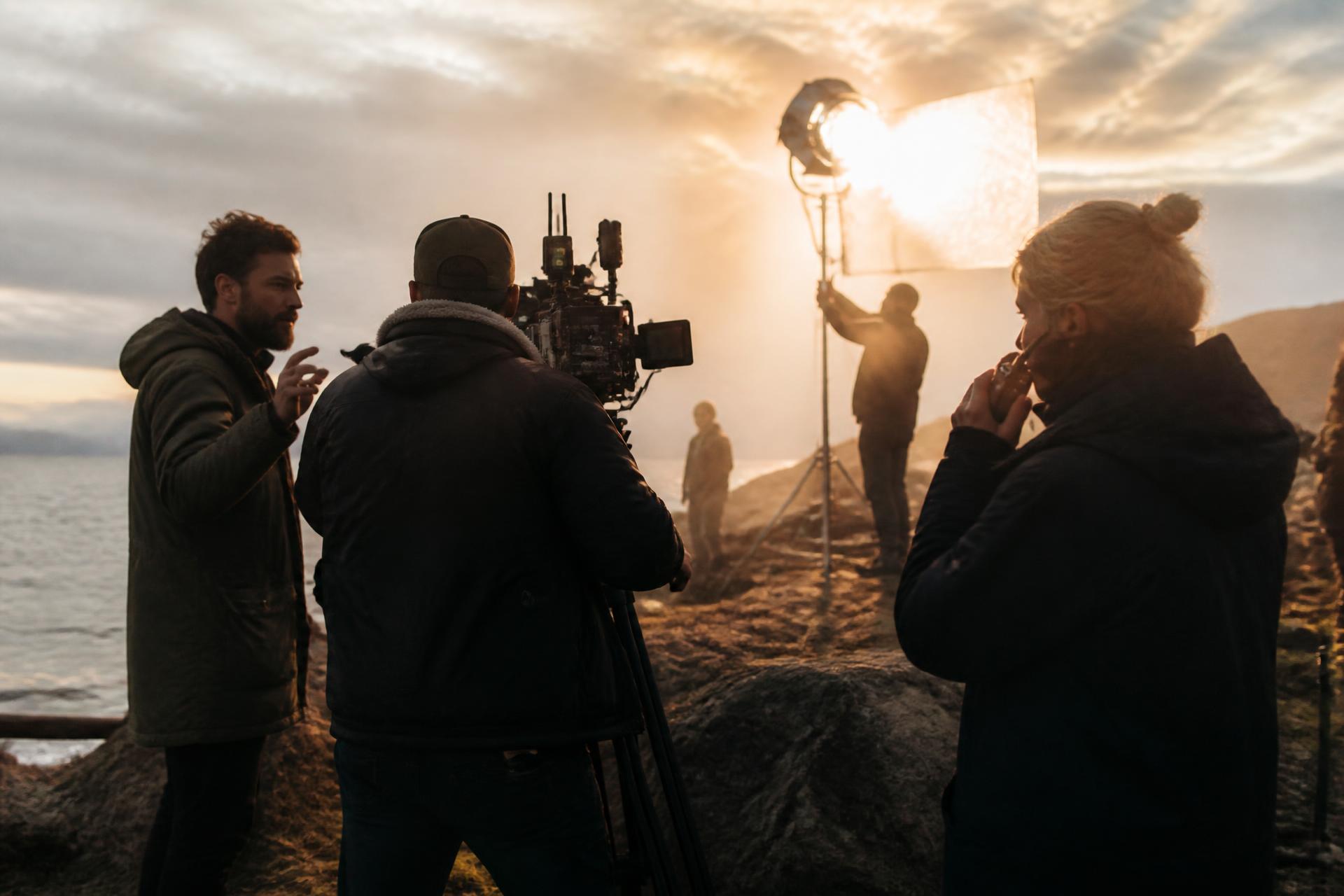 Nordic film crew on location at golden hour